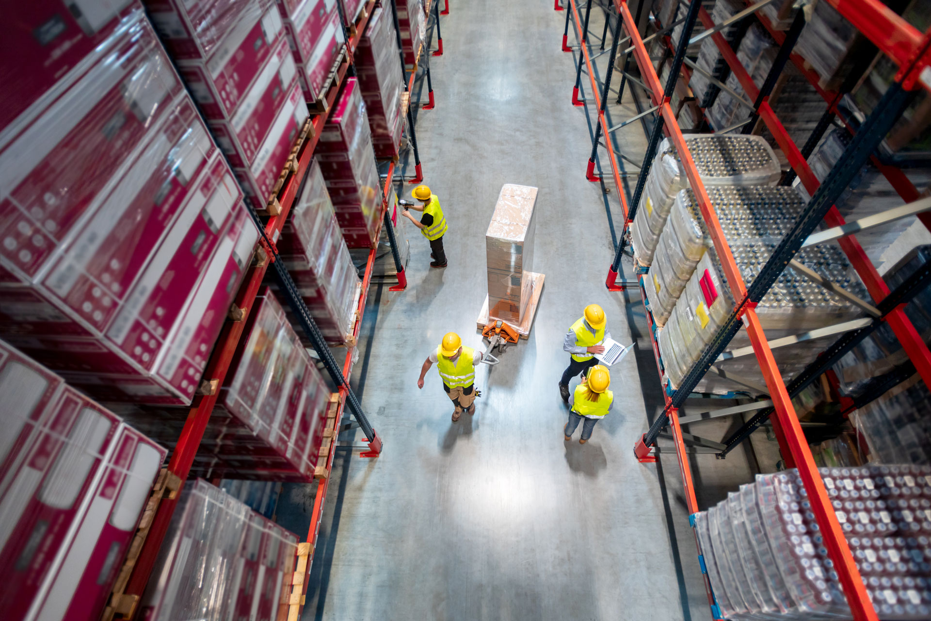 warehouse workers at work between rows of tall she 2024 10 31 01 12 28 utc